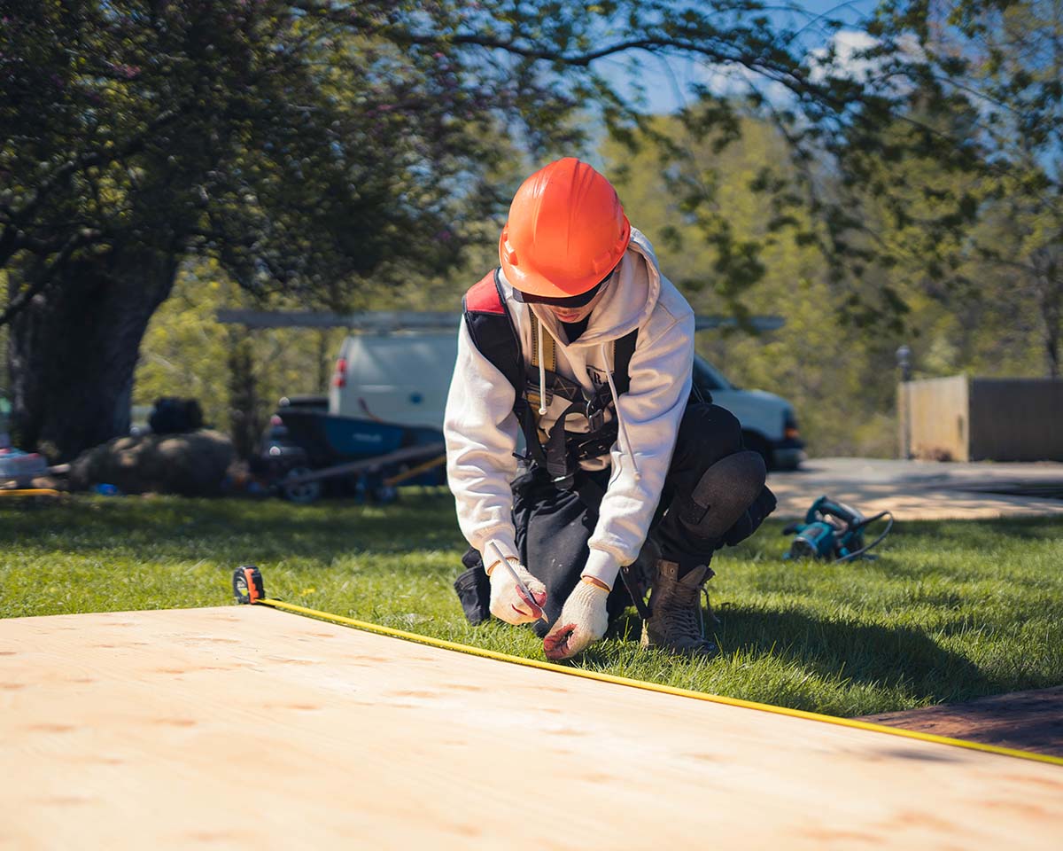 A Golden Group Roofing team member working on a roof replacement.