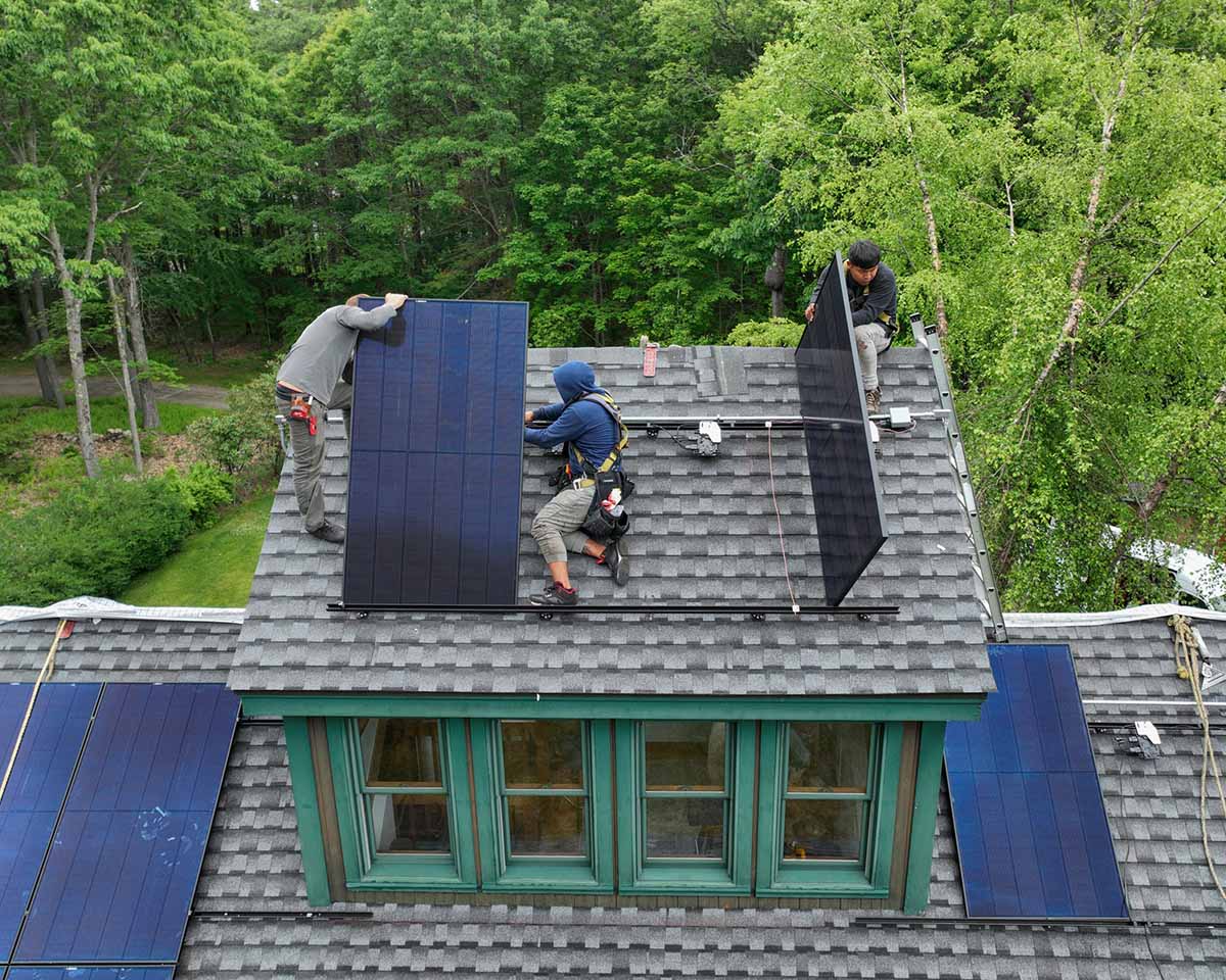 Golden Group Solar installing solar power panels on a Massachusetts home. 