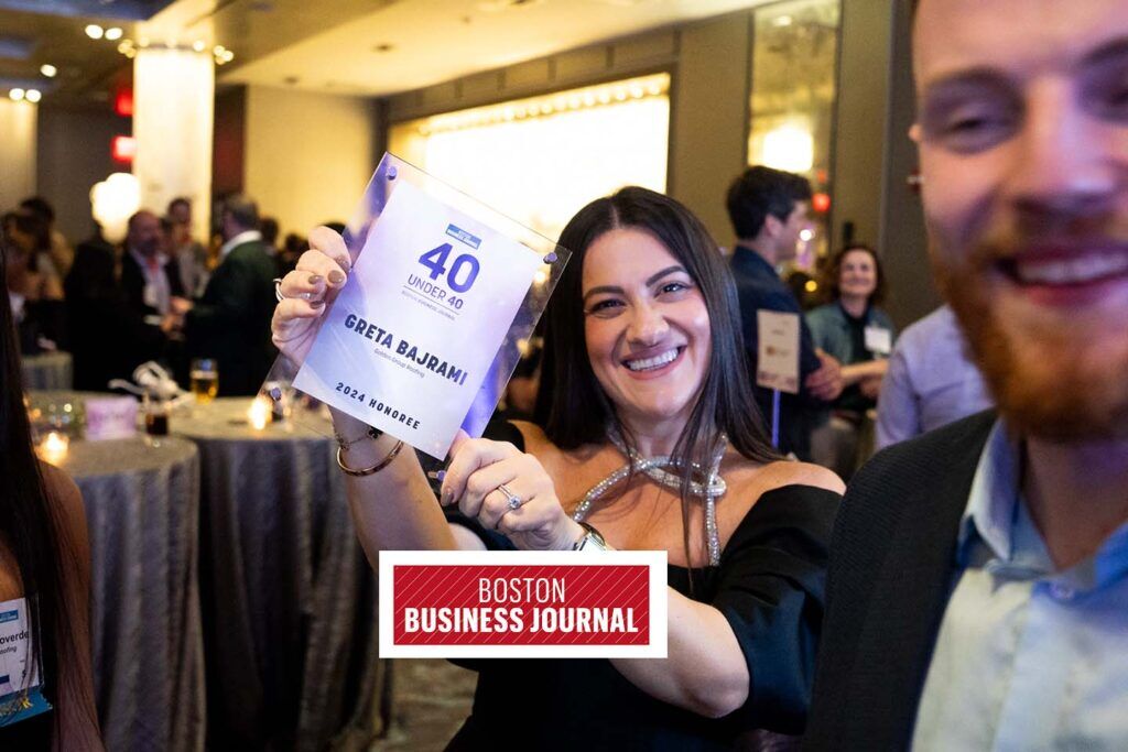 Greta celebrating 40 under 40 with Logo