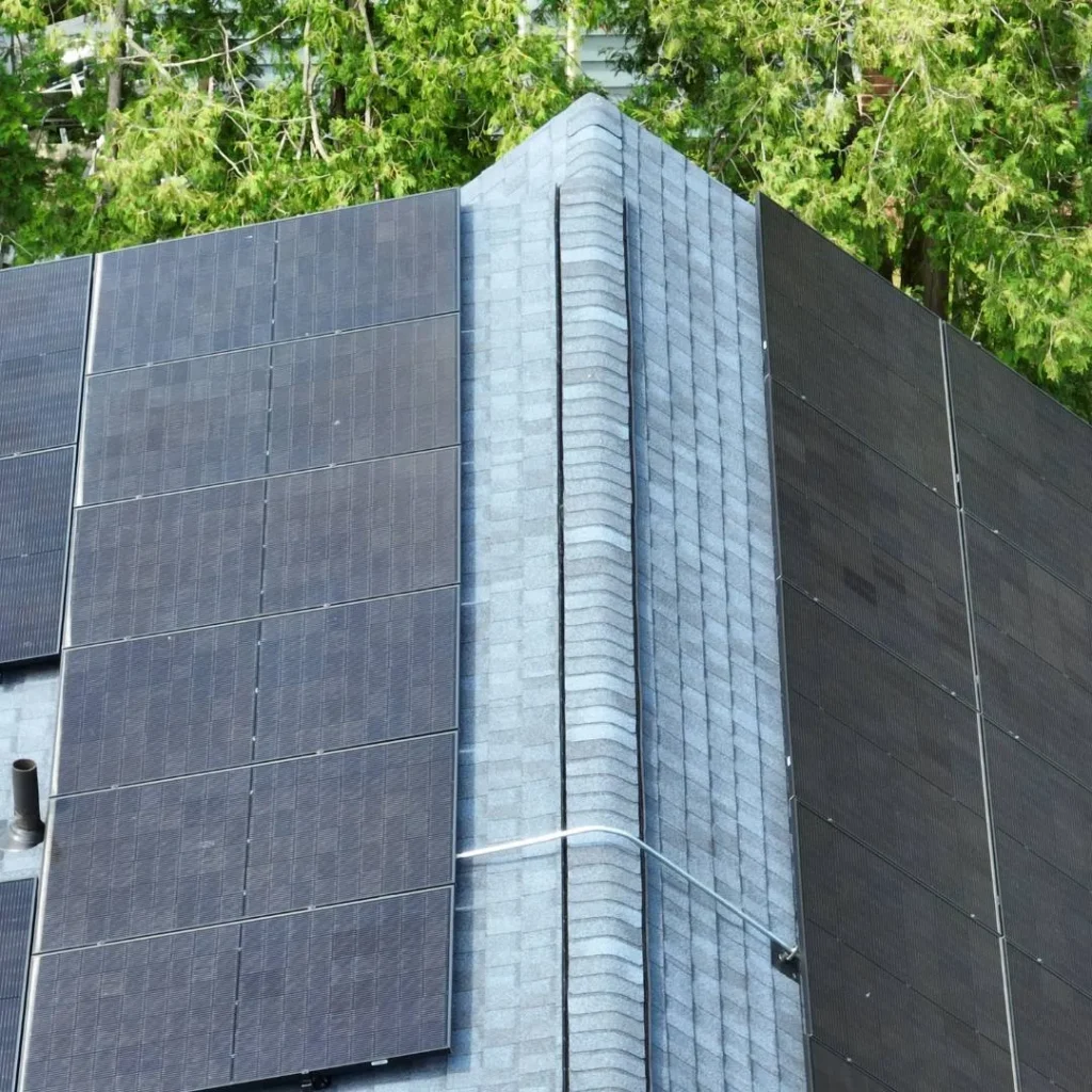 image of a rooftop with solar panels installed in Massachusetts.