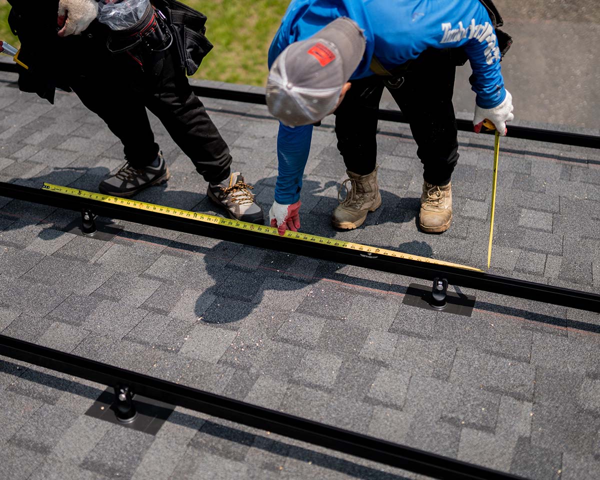 Golden Group Solar team working on installing solar panels. This is for blog post about the cost of solar panels.
