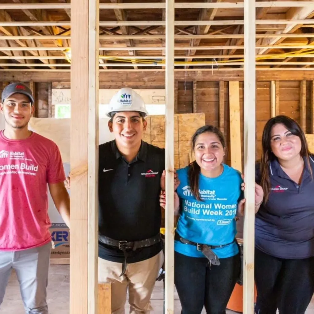 Westborough local roofers smiling at camera on site at a construction site