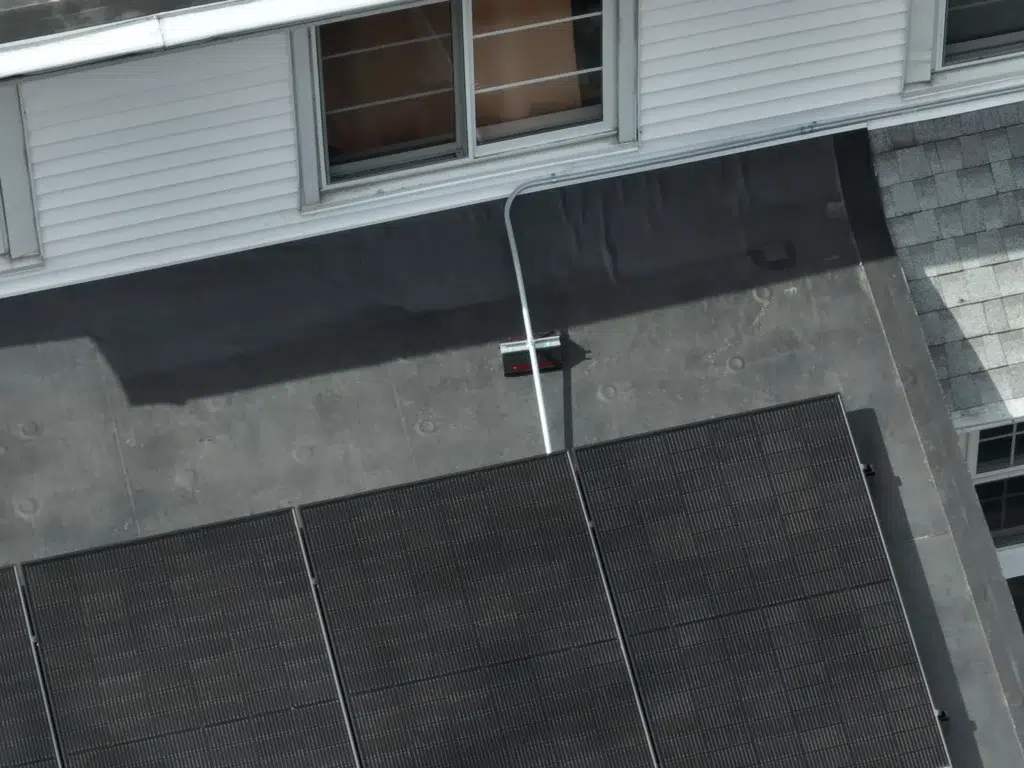 Aerial view of a slanted Rooftop Solar Panels installation in Newton, Massachusetts
