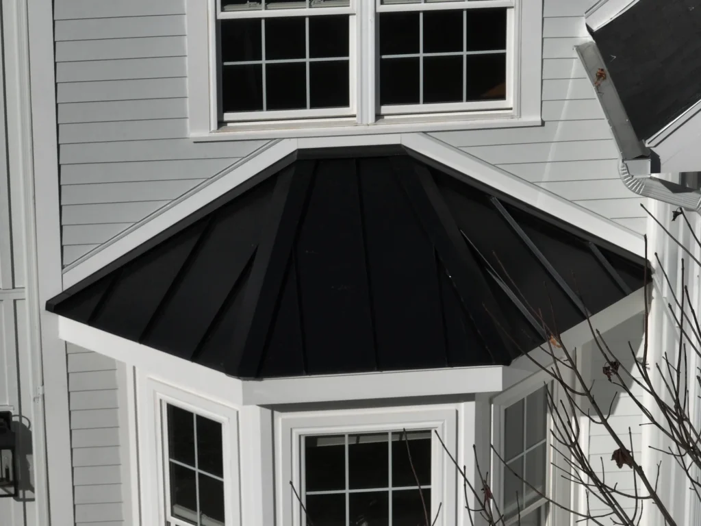 Aerial view of new professional siding services in Hudson, MA by Golden Group Roofing.