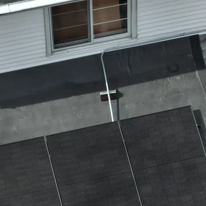 Aerial view of a slanted Rooftop Solar Panels installation in Newton, Massachusetts
