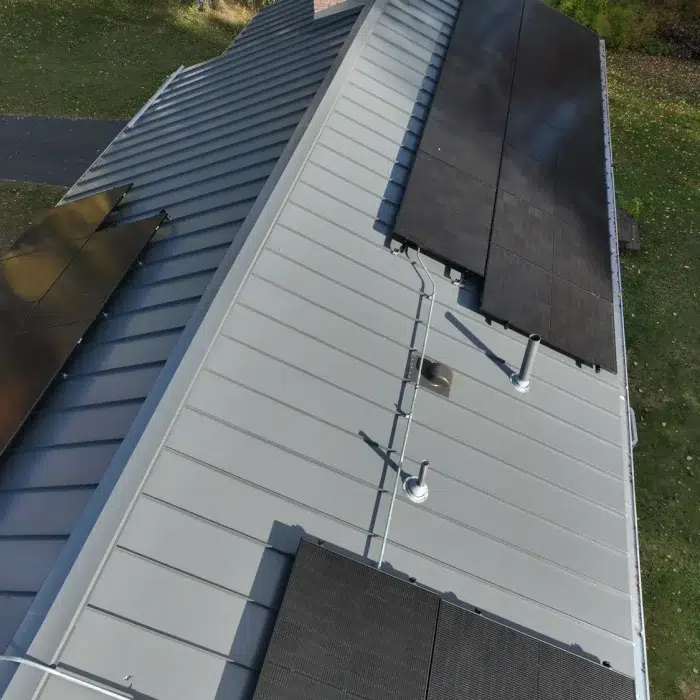 Aerial view of a Completed Solar Roofing Solution project on a metal roof in Framingham, MA