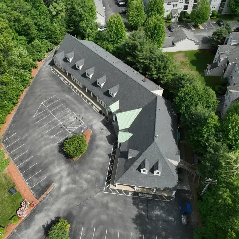 Complete Roof Replacement project on a local business in Worcester, Massachusetts with a new shingled roof.