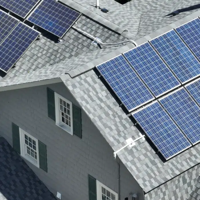 Ariel view of a multiple slanted roof Mounted Solar power Installations in Hudson, MA
