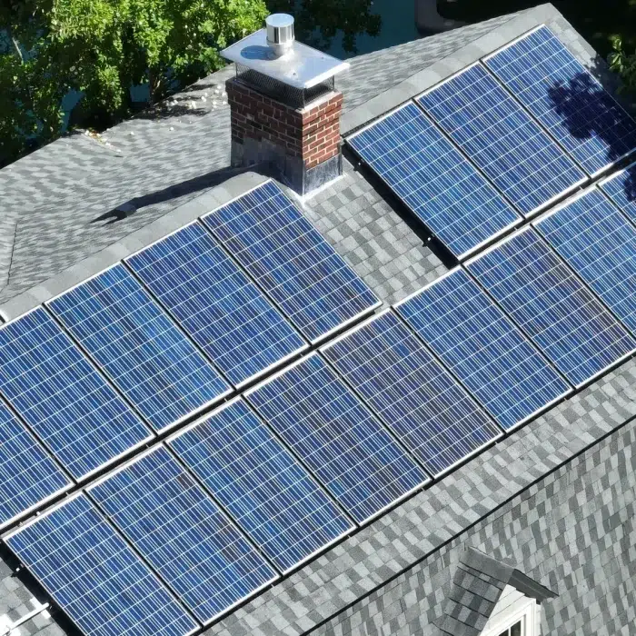 Aerial view of a Completed Solar Roofing Solution project on a shingled roof in Hudson, MA