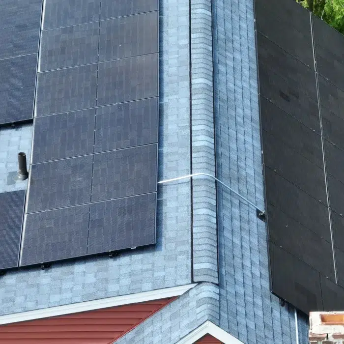 Ariel view of Power Solar Installation on a slanted shingled rooftop in Belmont, MA
