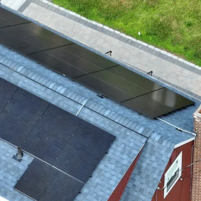 Ariel view of a residential home with Solar Installation in Belmont, MA by Golden Group Roofing