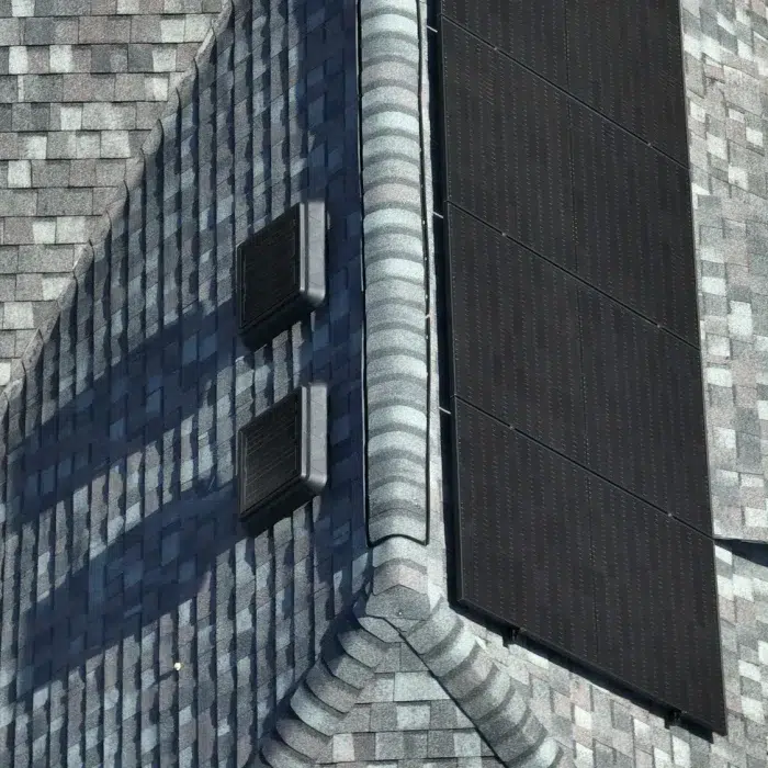 Aerial view of a Completed Solar Roofing Solution project on a shingled roof in Cambridge, Massachusetts