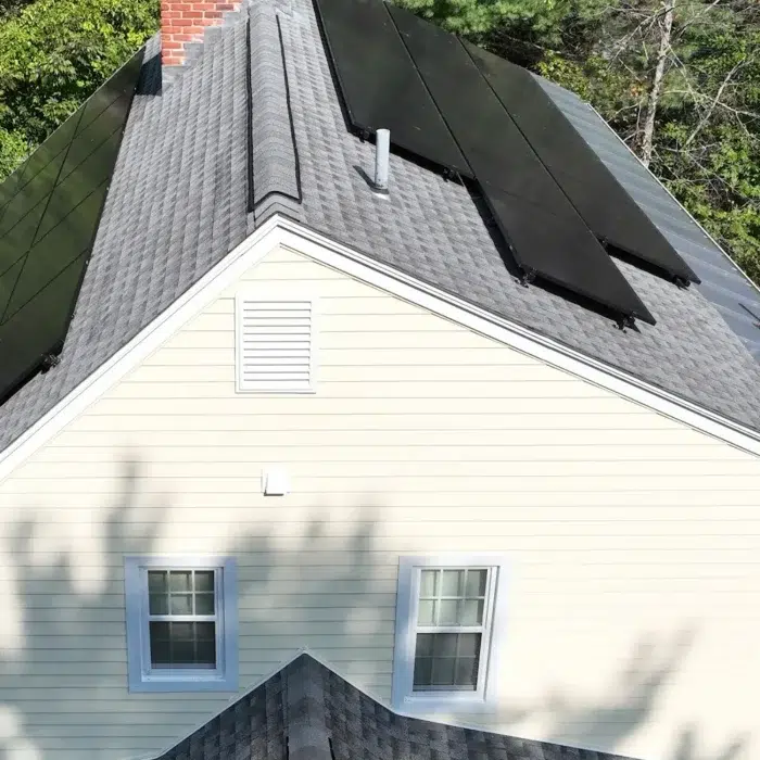 Side aerial view of a Solar Upgrade on a slanted roof in Westborough, MA