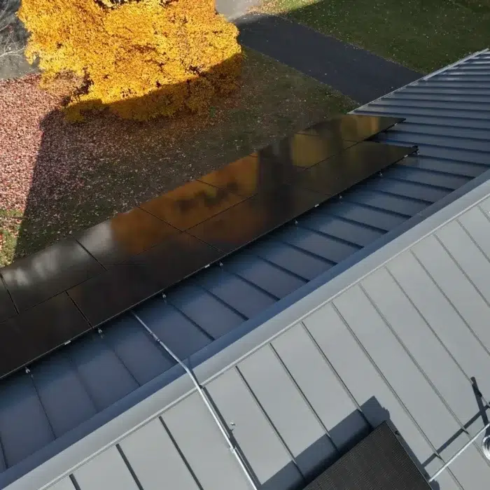 Aerial view of a Completed Solar Roofing Solution project on a metal roof in Framingham, MA