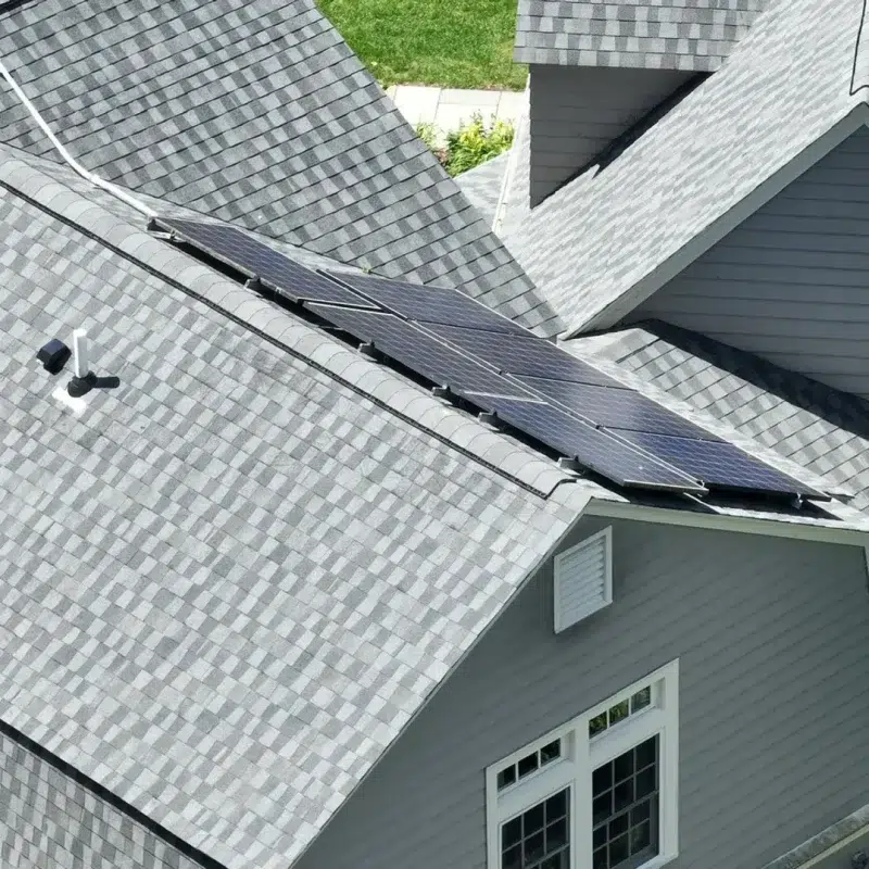 Shingle Roof and solar panel installation on multiple roof tops on a residential home in Waltham, Massachusetts